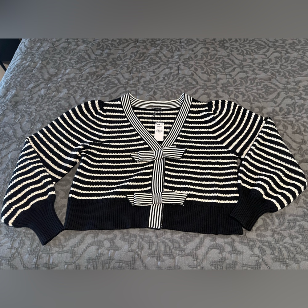 Express sweater with bow details. NWT